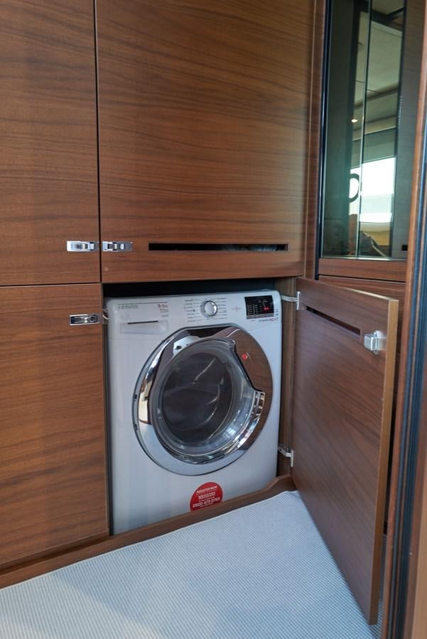 a washing machine in a room aboard PRINCESS M Yacht for Sale