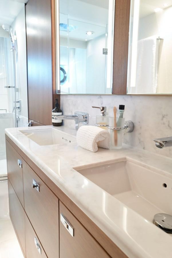 a bathroom with a large mirror aboard PRINCESS M Yacht for Sale