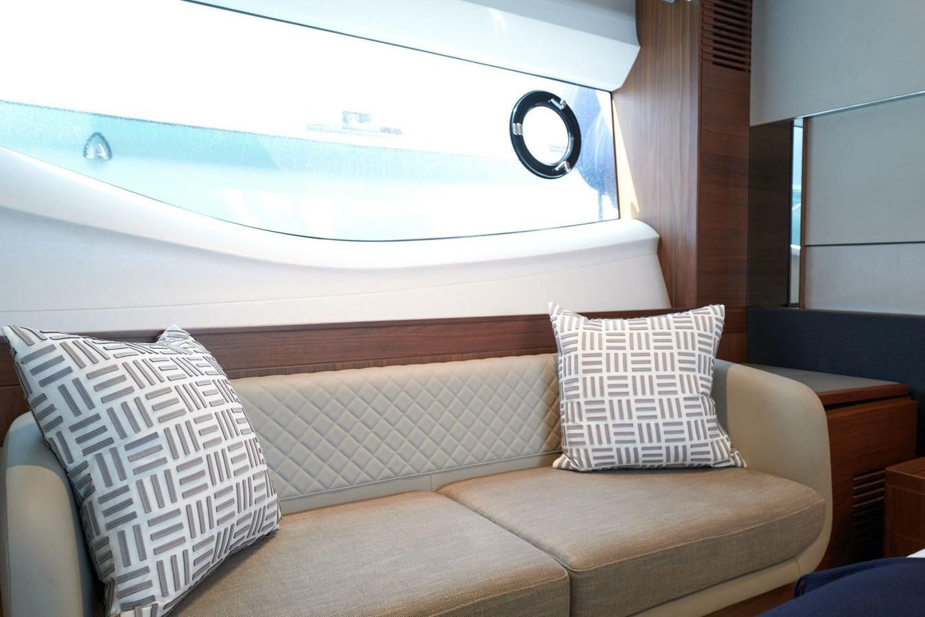 a couch with pillows aboard PRINCESS M Yacht for Sale