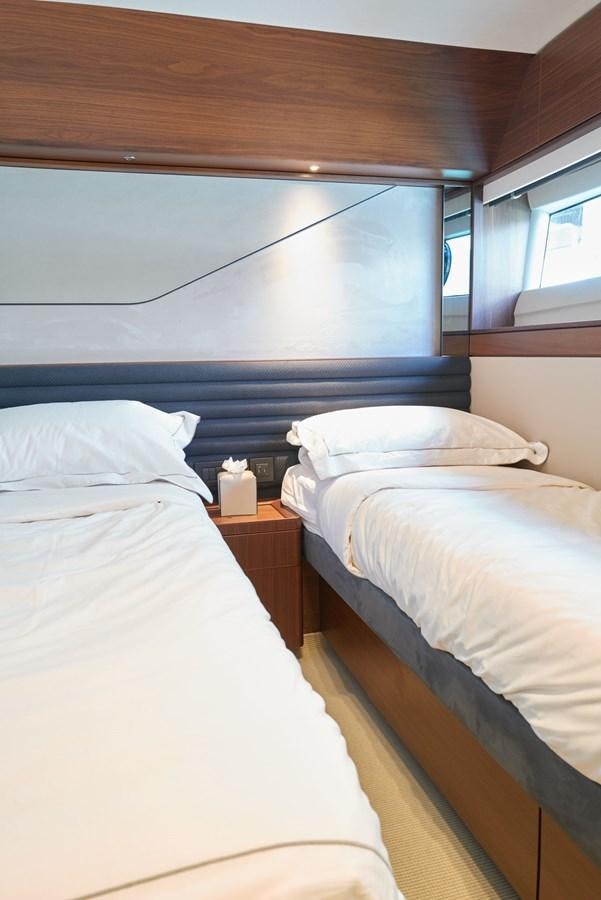 a couple of beds in a room aboard PRINCESS M Yacht for Sale