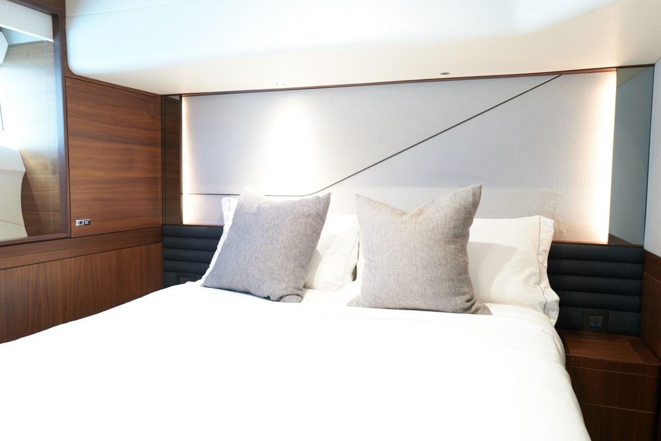 a bed with white pillows aboard PRINCESS M Yacht for Sale