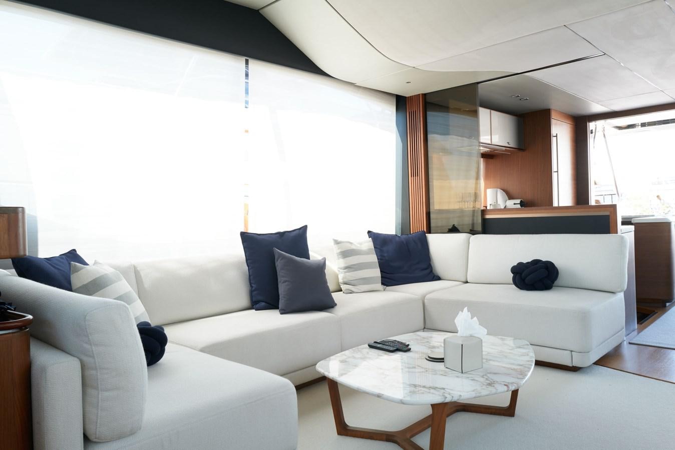 a living room with white couches aboard PRINCESS M Yacht for Sale