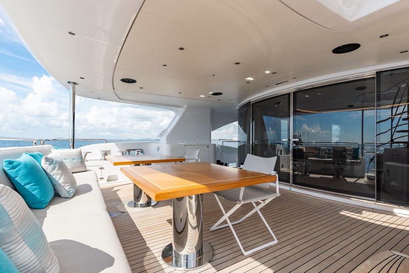 a room with a table and chairs aboard ABBENTURES III Yacht for Sale