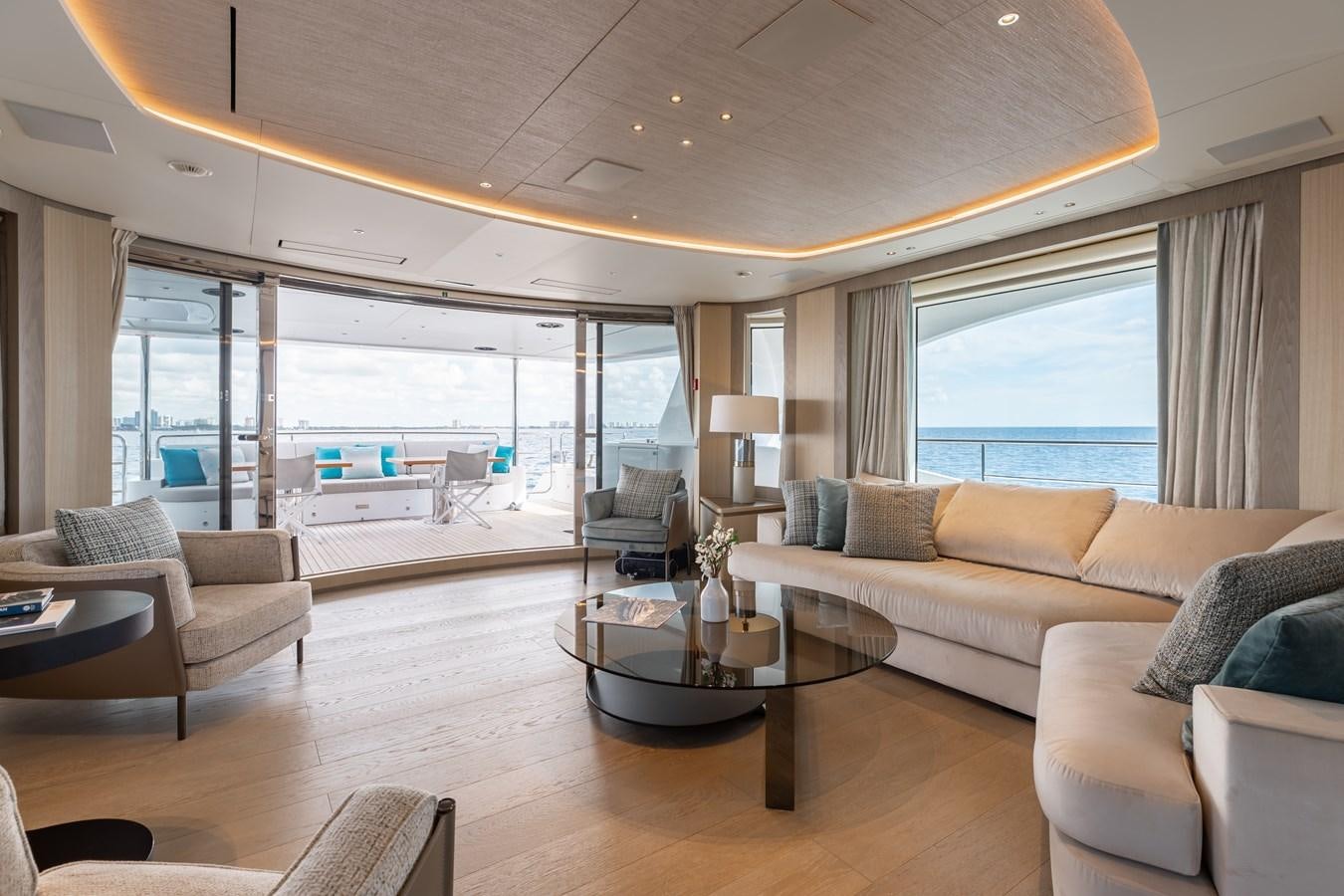 a living room with a large window aboard ABBENTURES III Yacht for Sale