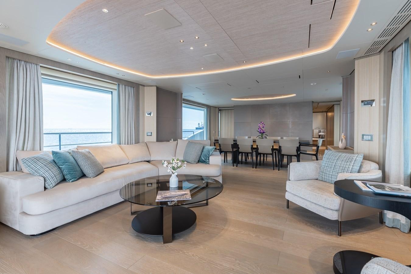 a living room with a large window aboard ABBENTURES III Yacht for Sale