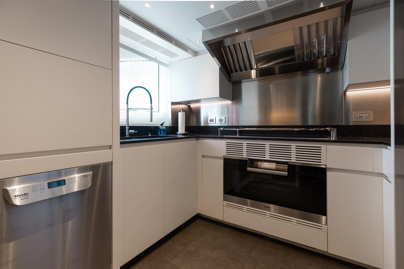 a kitchen with stainless steel appliances aboard ABBENTURES III Yacht for Sale