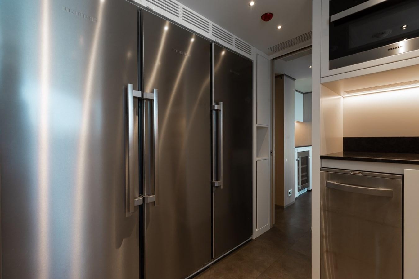 a large kitchen with stainless steel appliances aboard ABBENTURES III Yacht for Sale