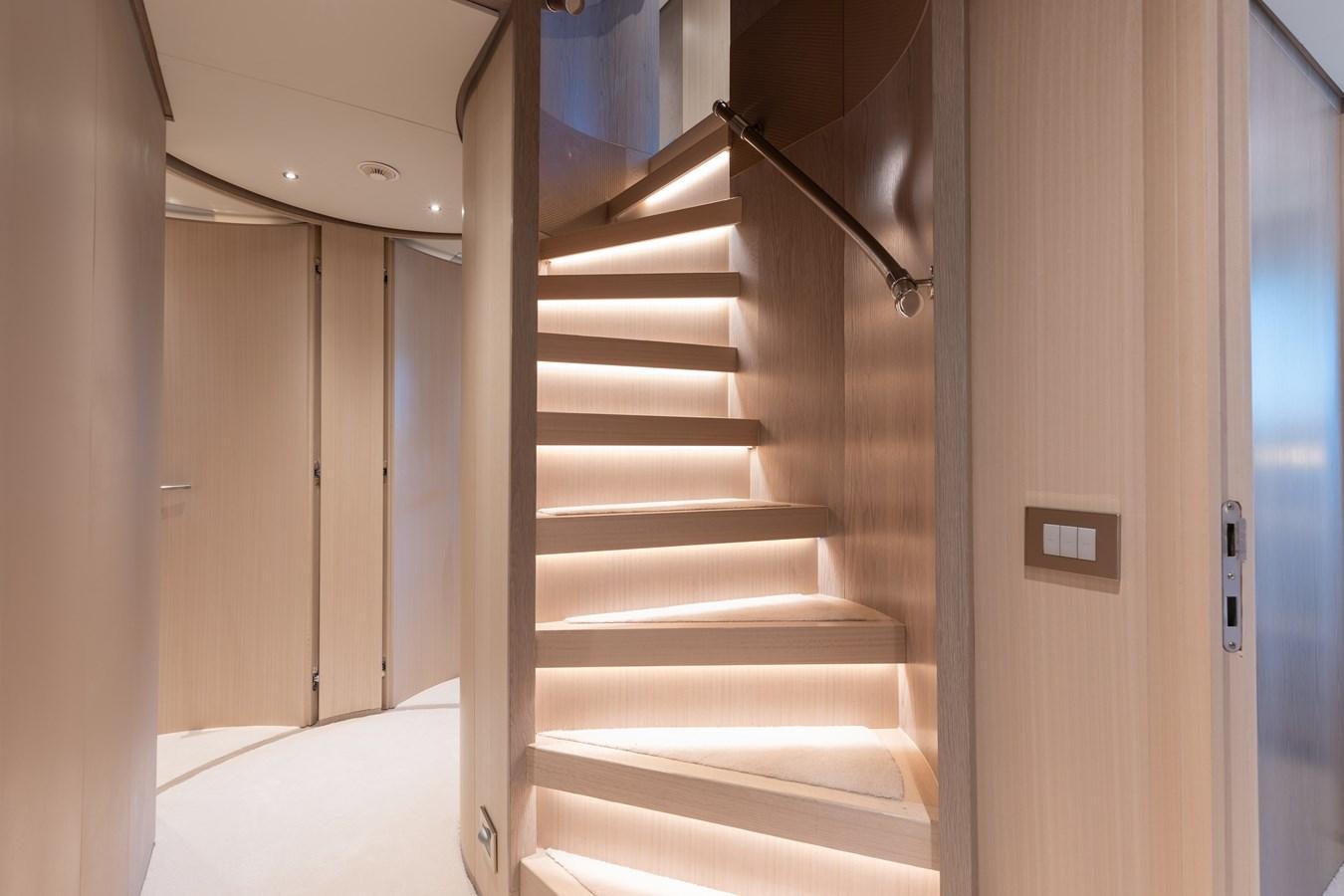 a white staircase in a room aboard ABBENTURES III Yacht for Sale