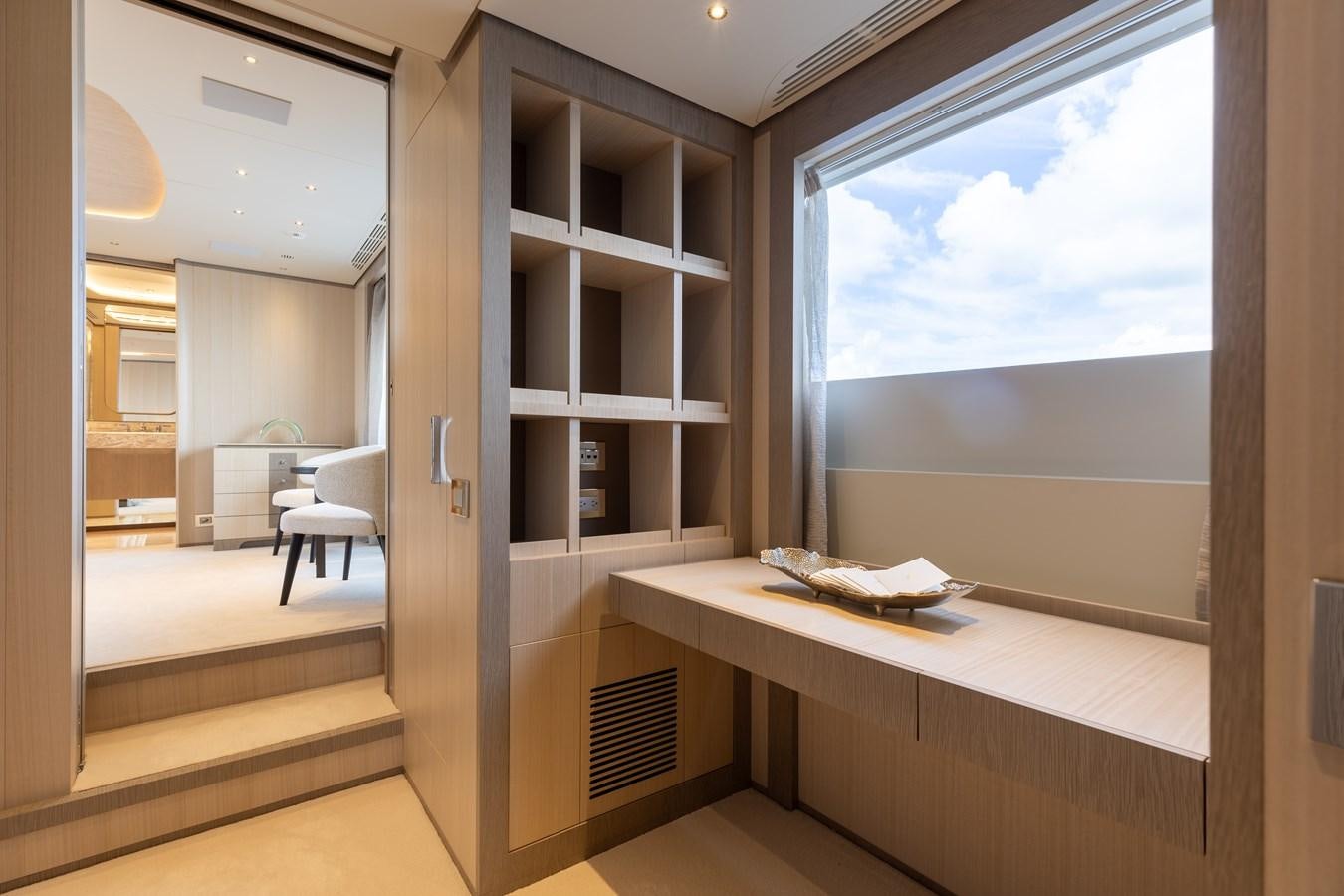 a room with a window and a desk aboard ABBENTURES III Yacht for Sale