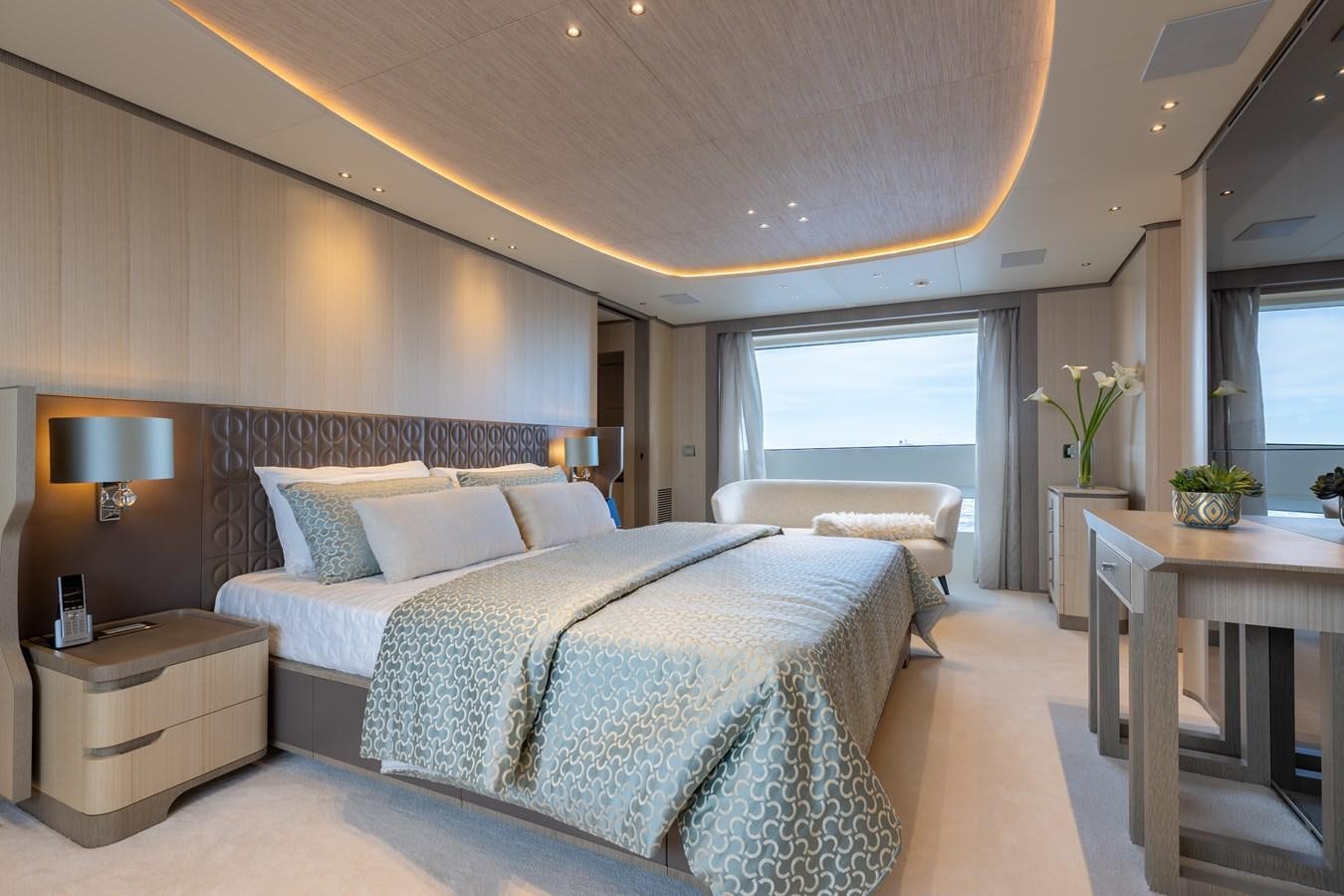 a large bedroom with a large bed aboard ABBENTURES III Yacht for Sale