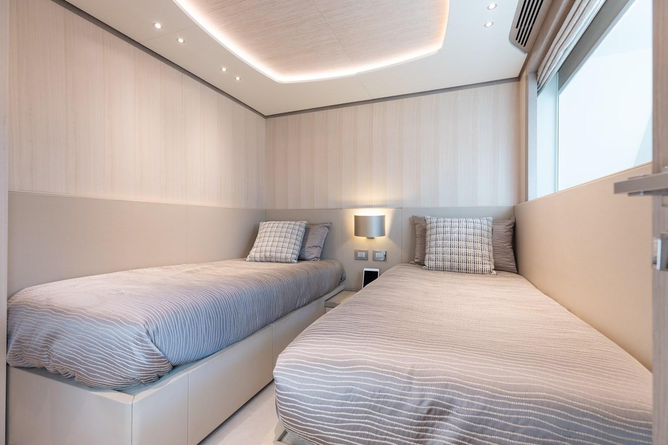 a room with two beds aboard ABBENTURES III Yacht for Sale