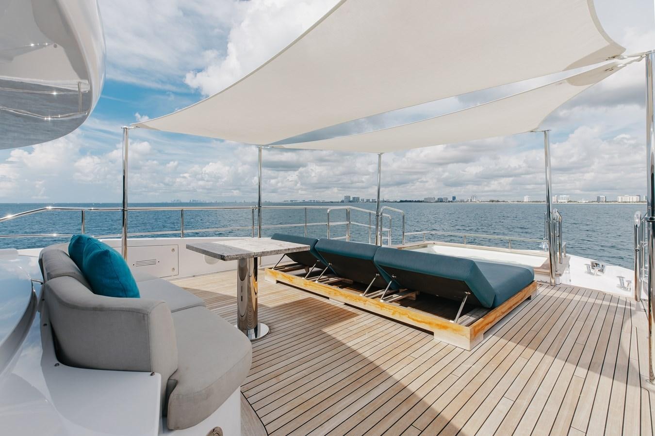 a lounge chair next to a pool aboard ABBENTURES III Yacht for Sale