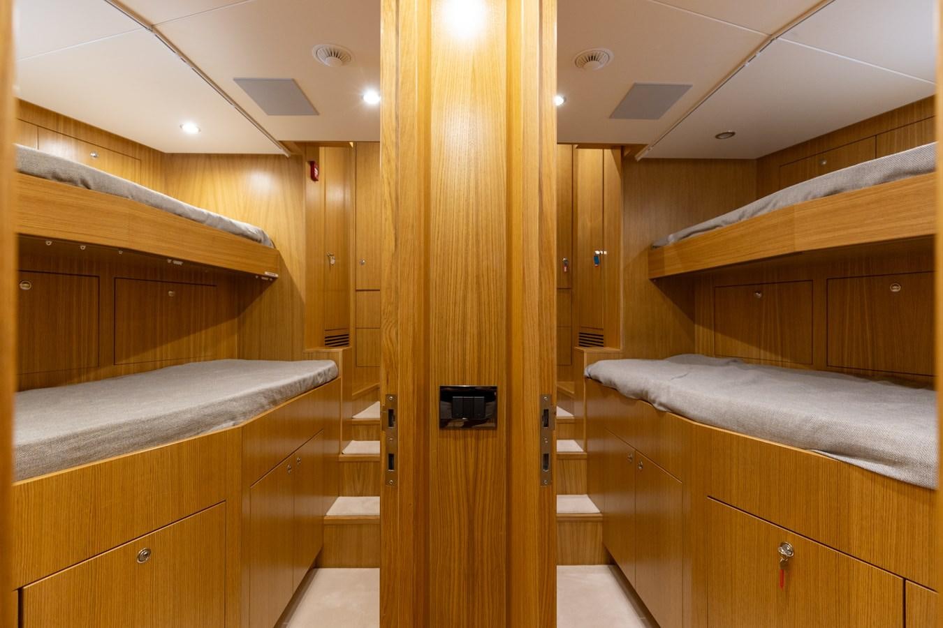 a room with wooden cabinets aboard ABBENTURES III Yacht for Sale