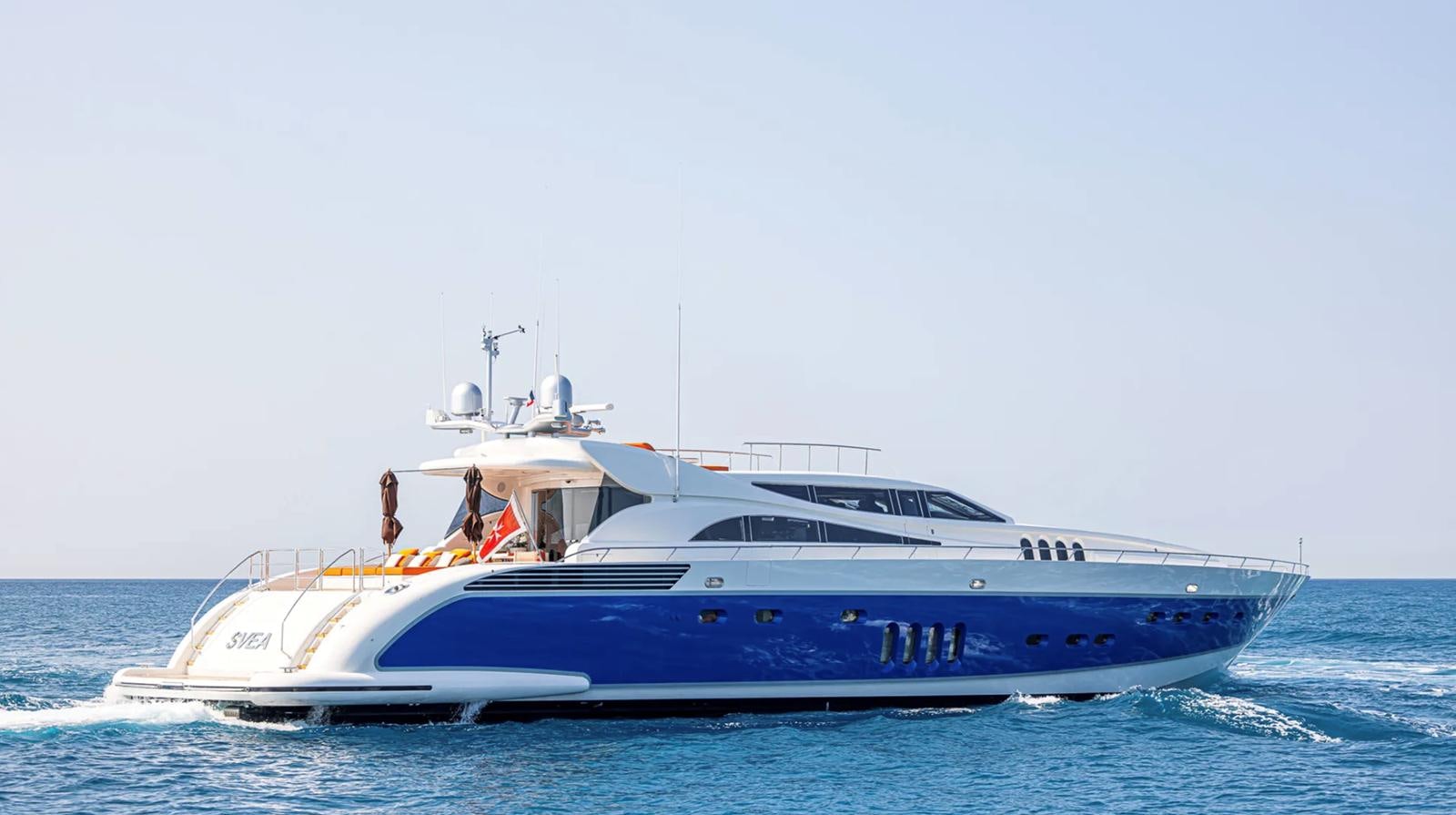 a white yacht on the water aboard SVEA Yacht for Sale