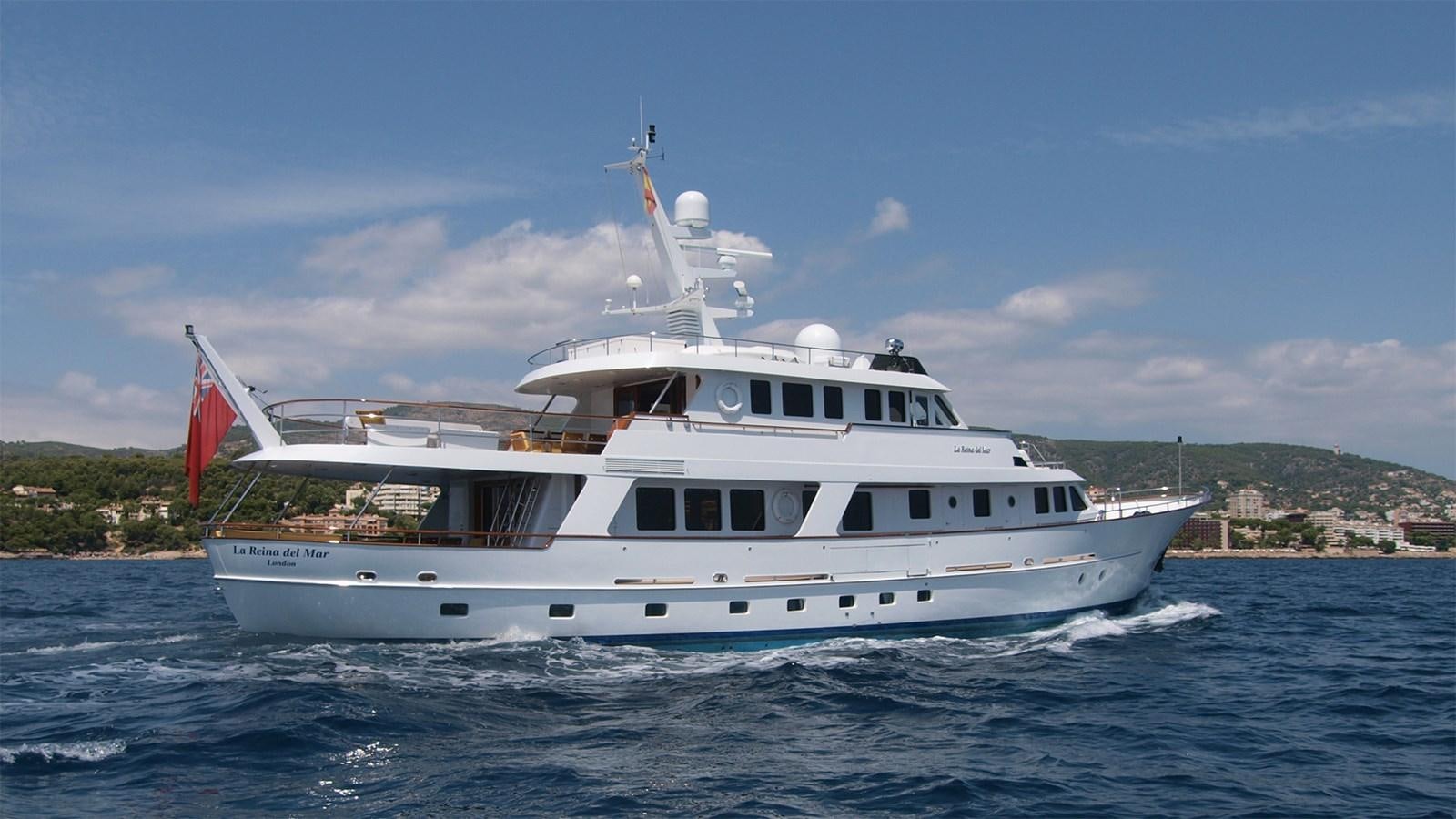 a large white boat on the water aboard LA REINA DEL MAR Yacht for Sale