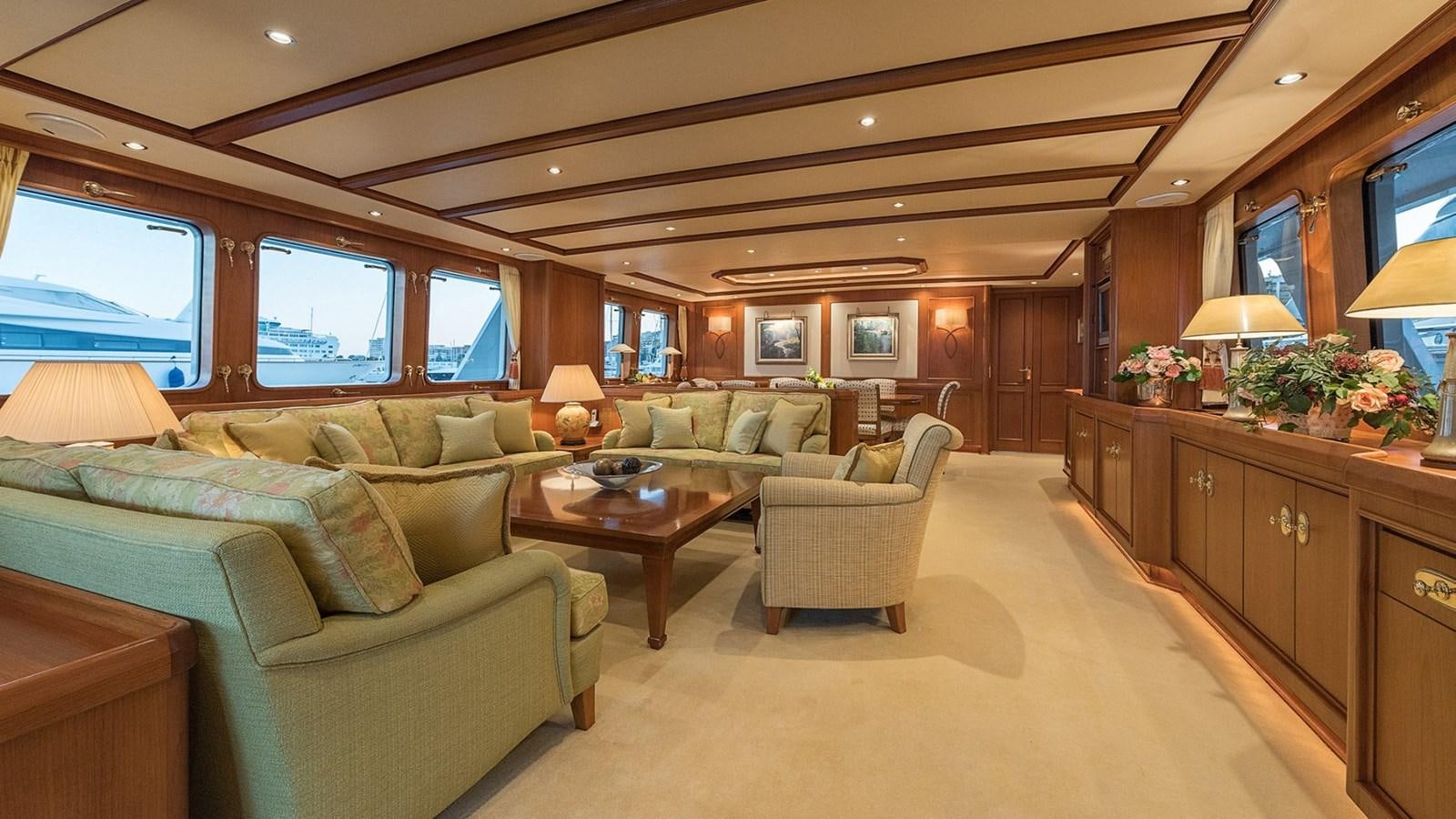 a living room with a couch and a table aboard LA REINA DEL MAR Yacht for Sale