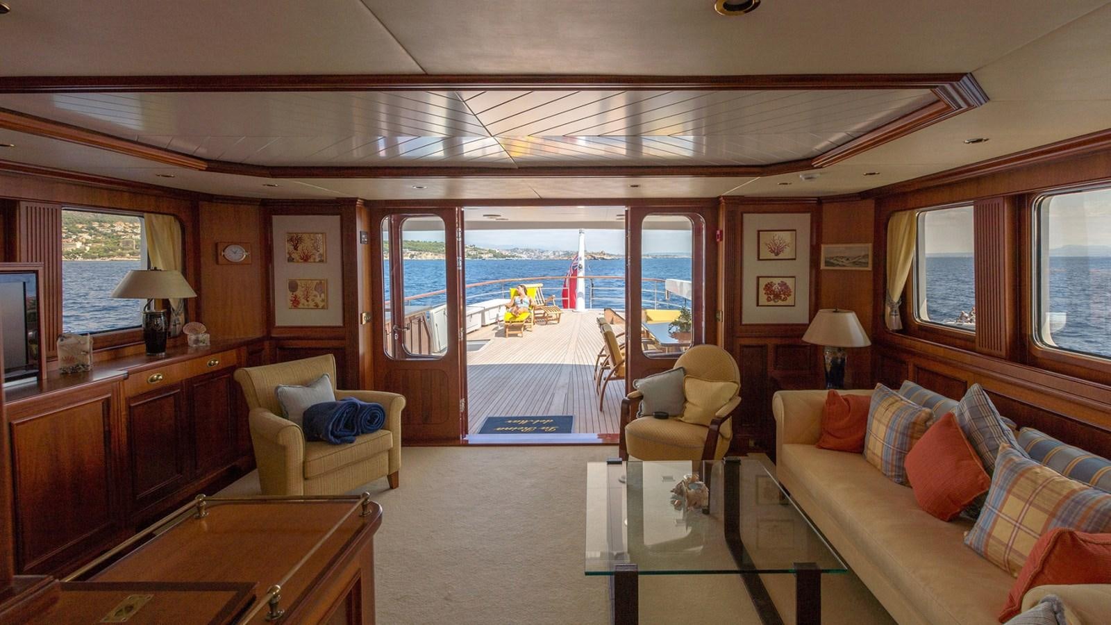 a living room with a large glass door aboard LA REINA DEL MAR Yacht for Sale