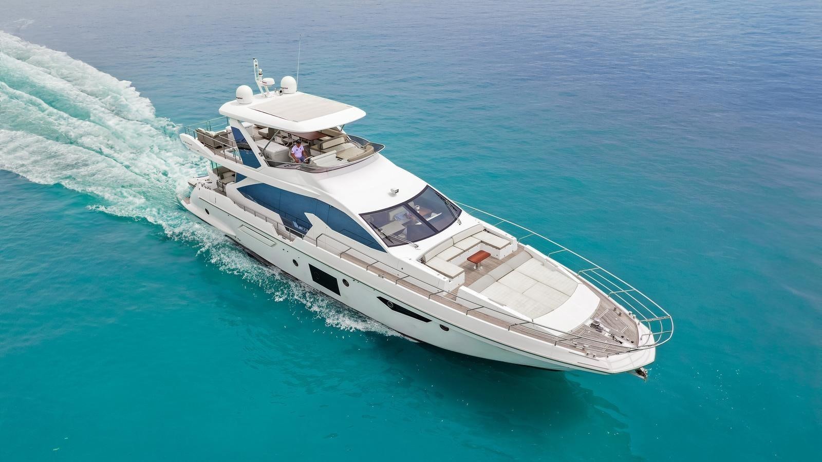 a white boat in the water aboard TK Yacht for Sale