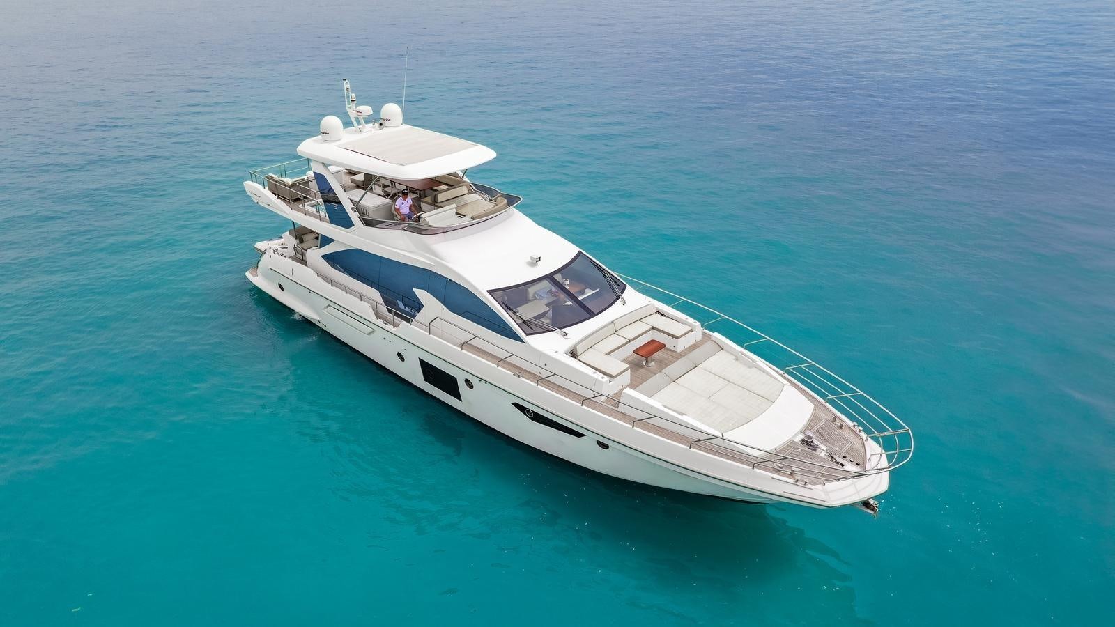 a white boat in the water aboard TK Yacht for Sale