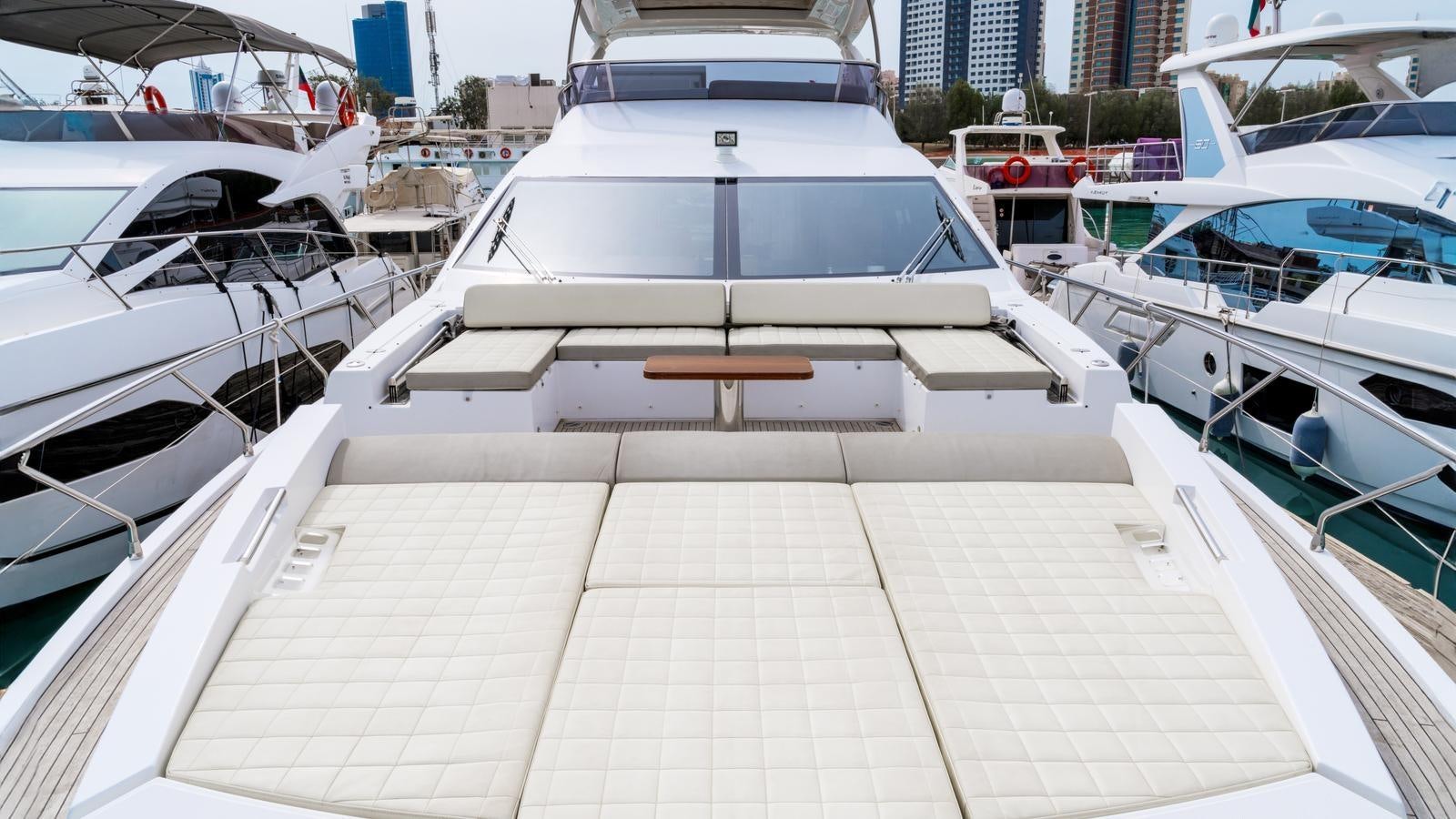 a dock with many boats aboard TK Yacht for Sale
