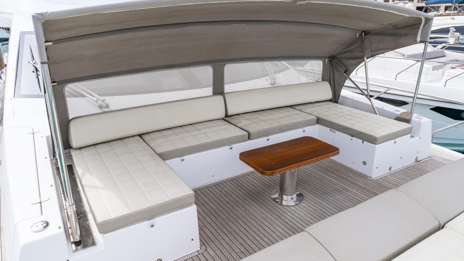 a chair on a deck aboard TK Yacht for Sale