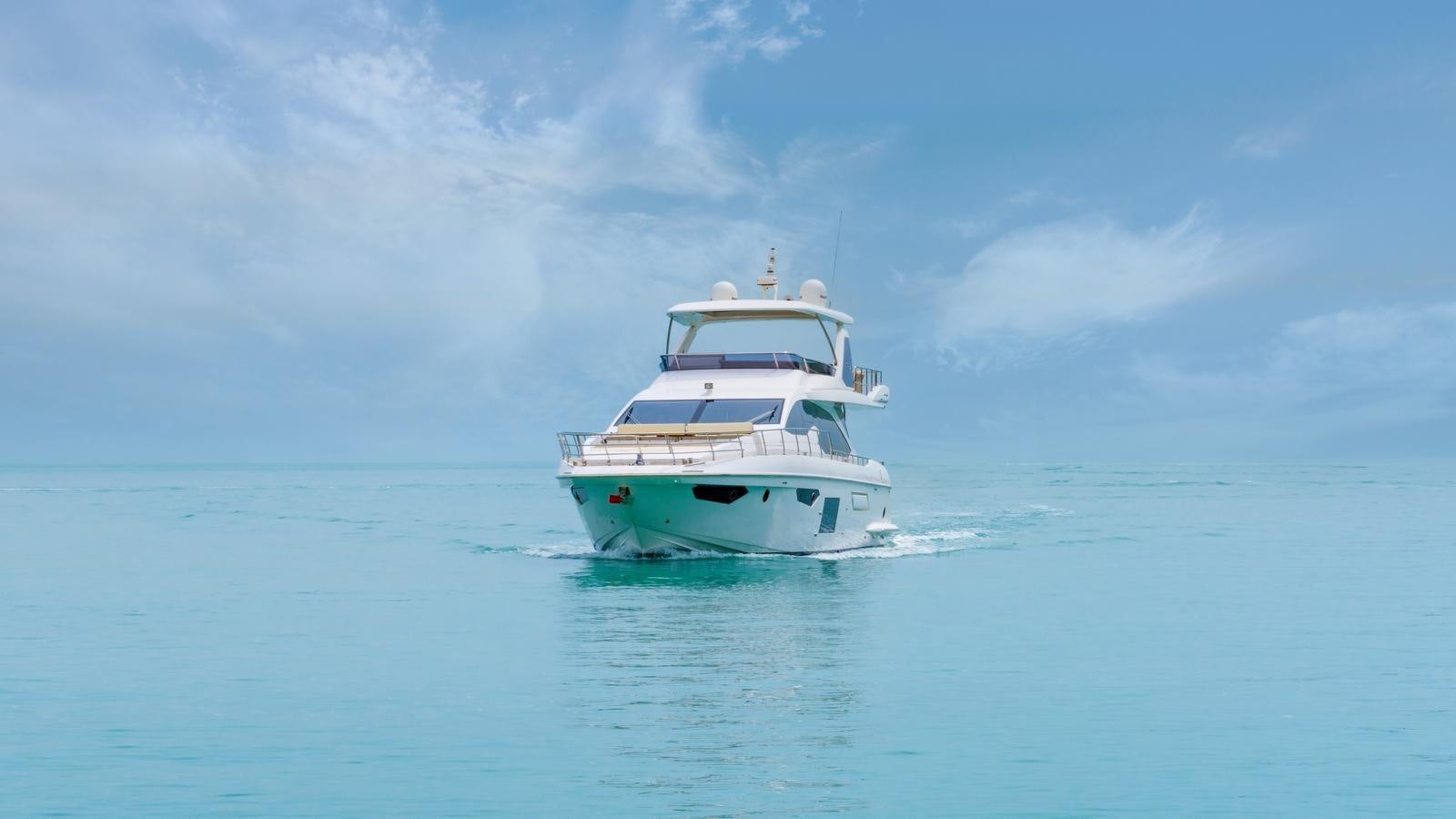 a white boat in the water aboard TK Yacht for Sale