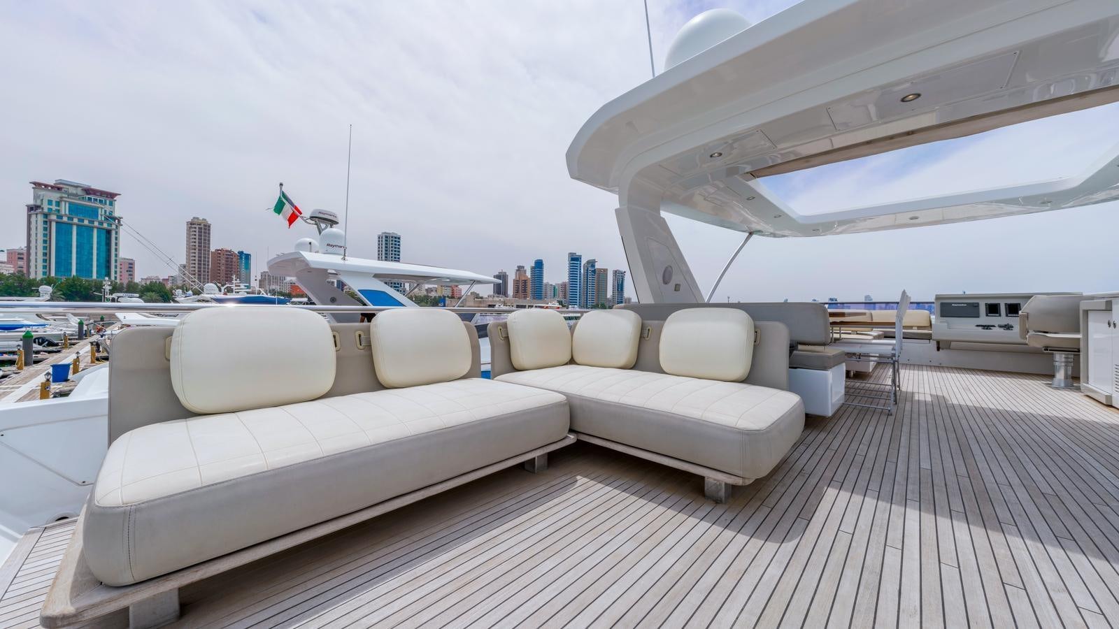 a white couch on a deck aboard TK Yacht for Sale