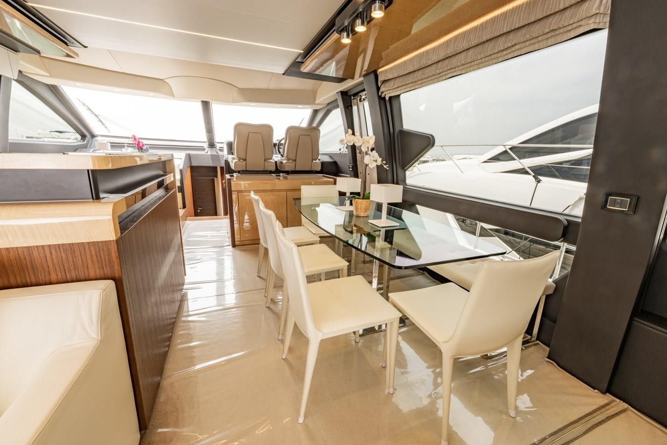 a room with a table and chairs aboard TK Yacht for Sale