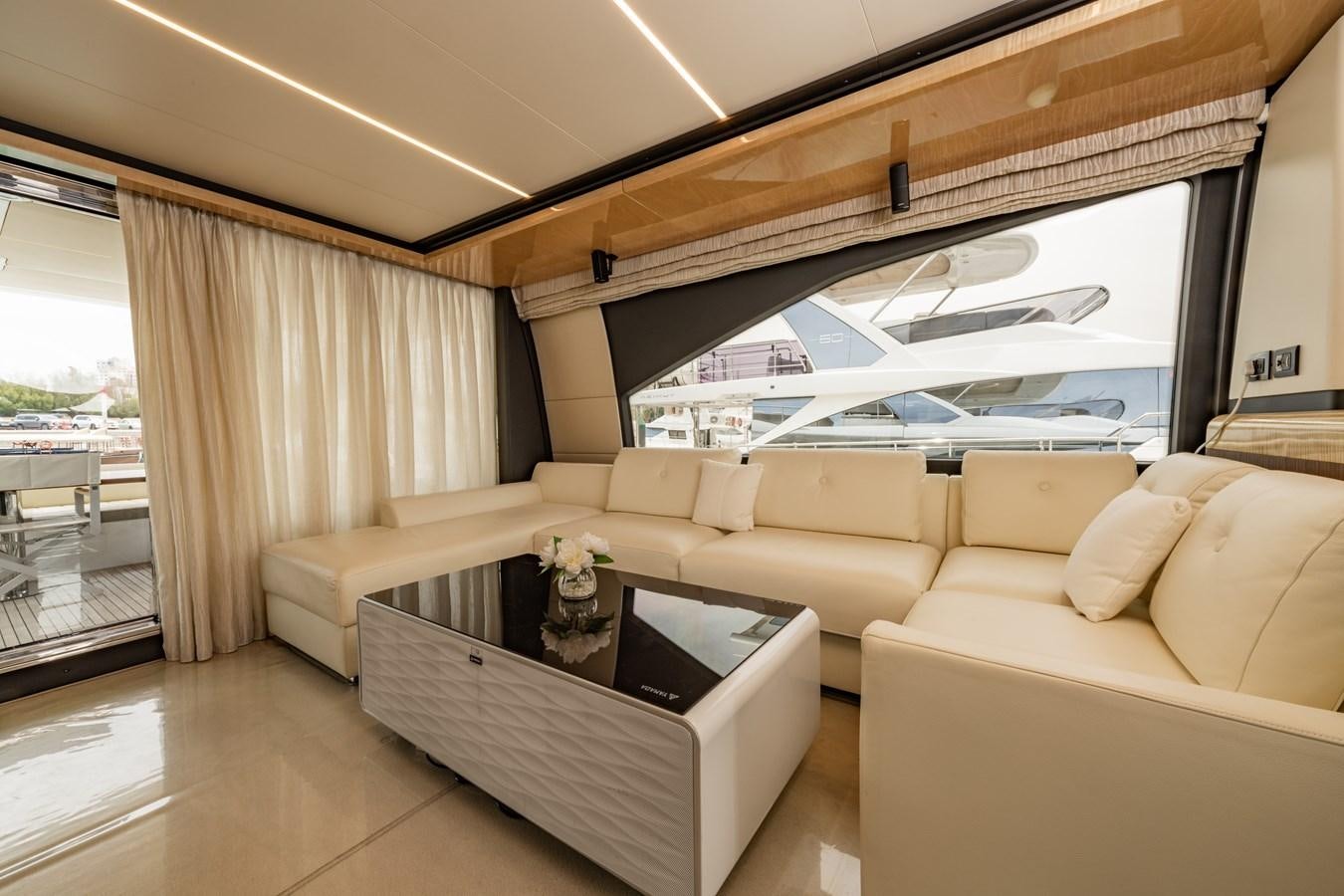 a living room with a large window aboard TK Yacht for Sale