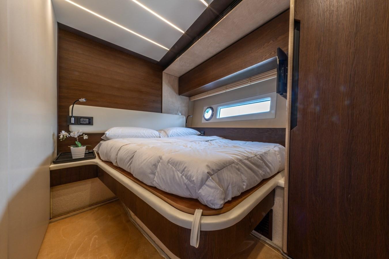 a bed in a room aboard TK Yacht for Sale