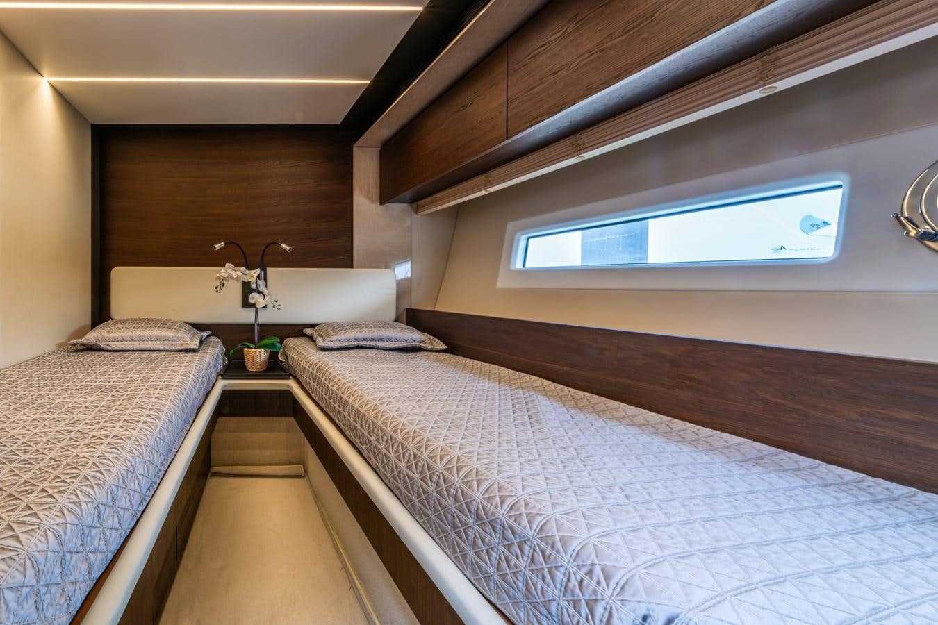 a room with two beds aboard TK Yacht for Sale
