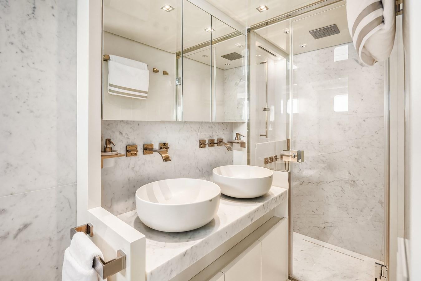 a bathroom with two sinks aboard SANLORENZO SX88/81 Yacht for Sale