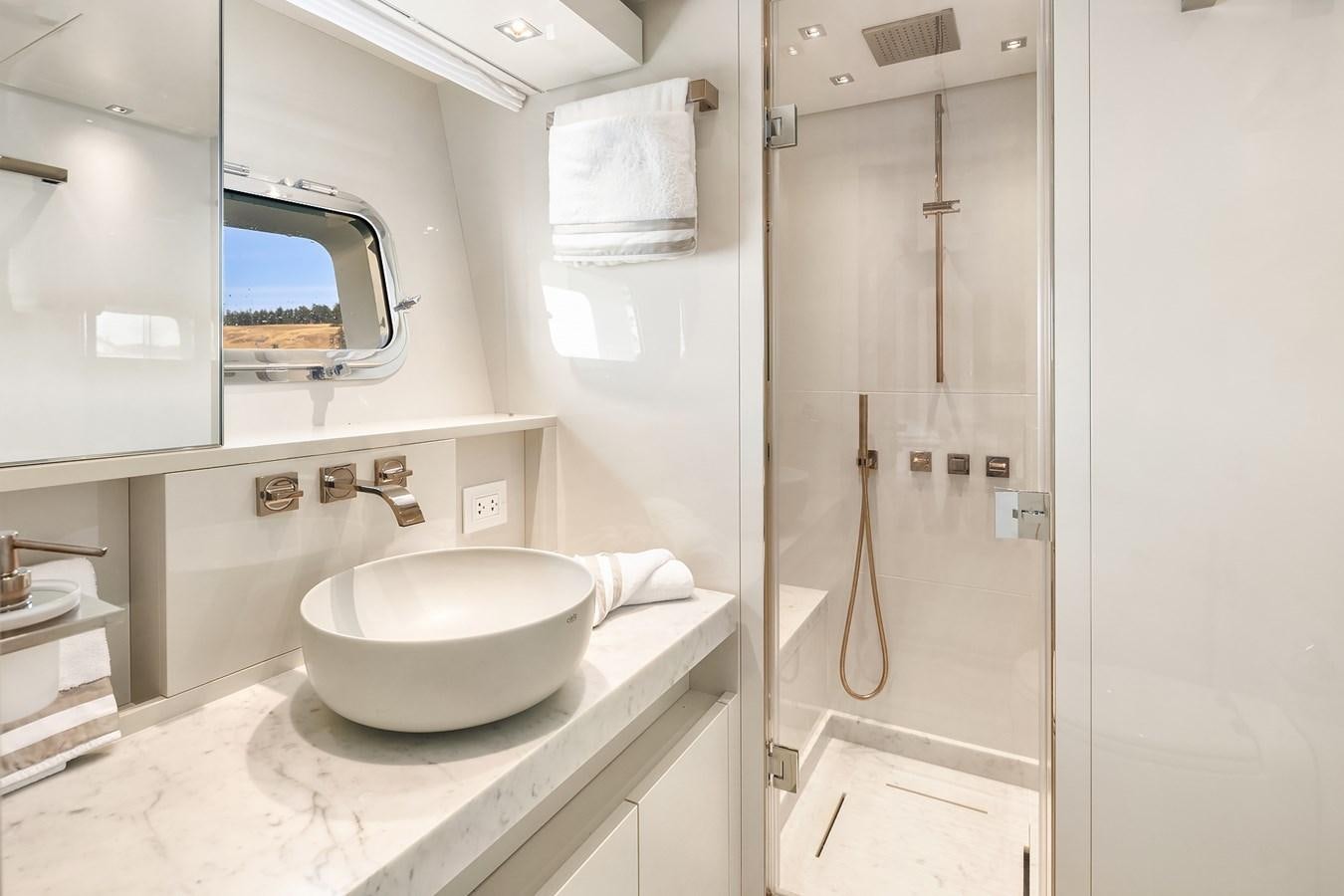 a bathroom with a sink and shower aboard SANLORENZO SX88/81 Yacht for Sale