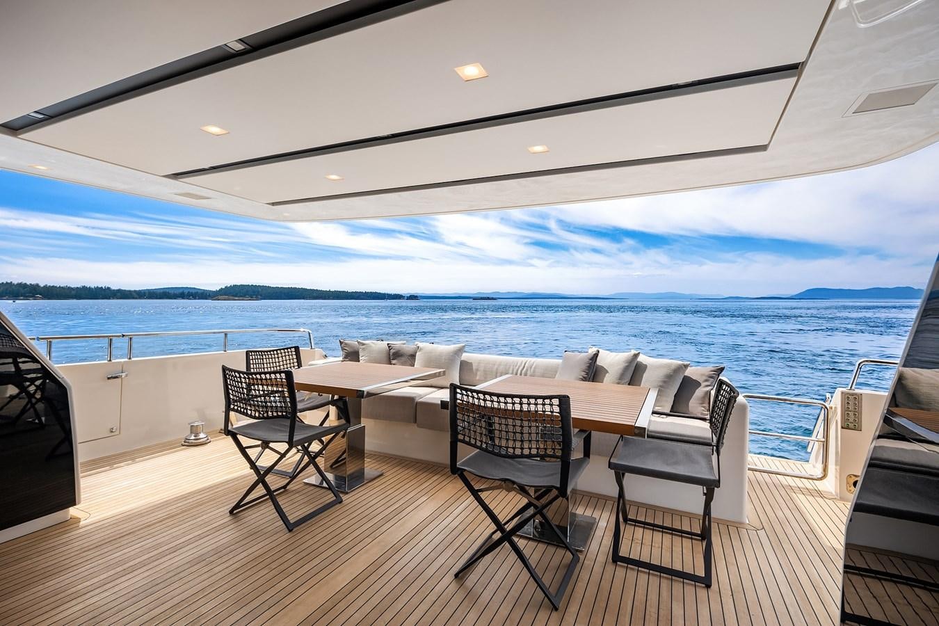 a room with a table and chairs aboard SANLORENZO SX88/81 Yacht for Sale