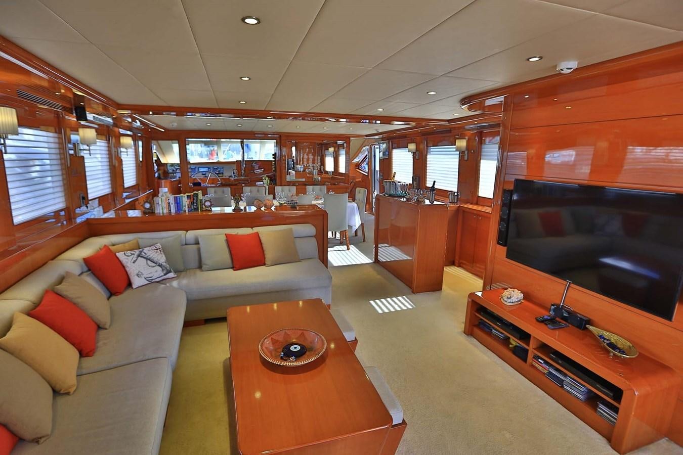 a living room with a couch and a coffee table aboard GULMARIA Yacht for Sale