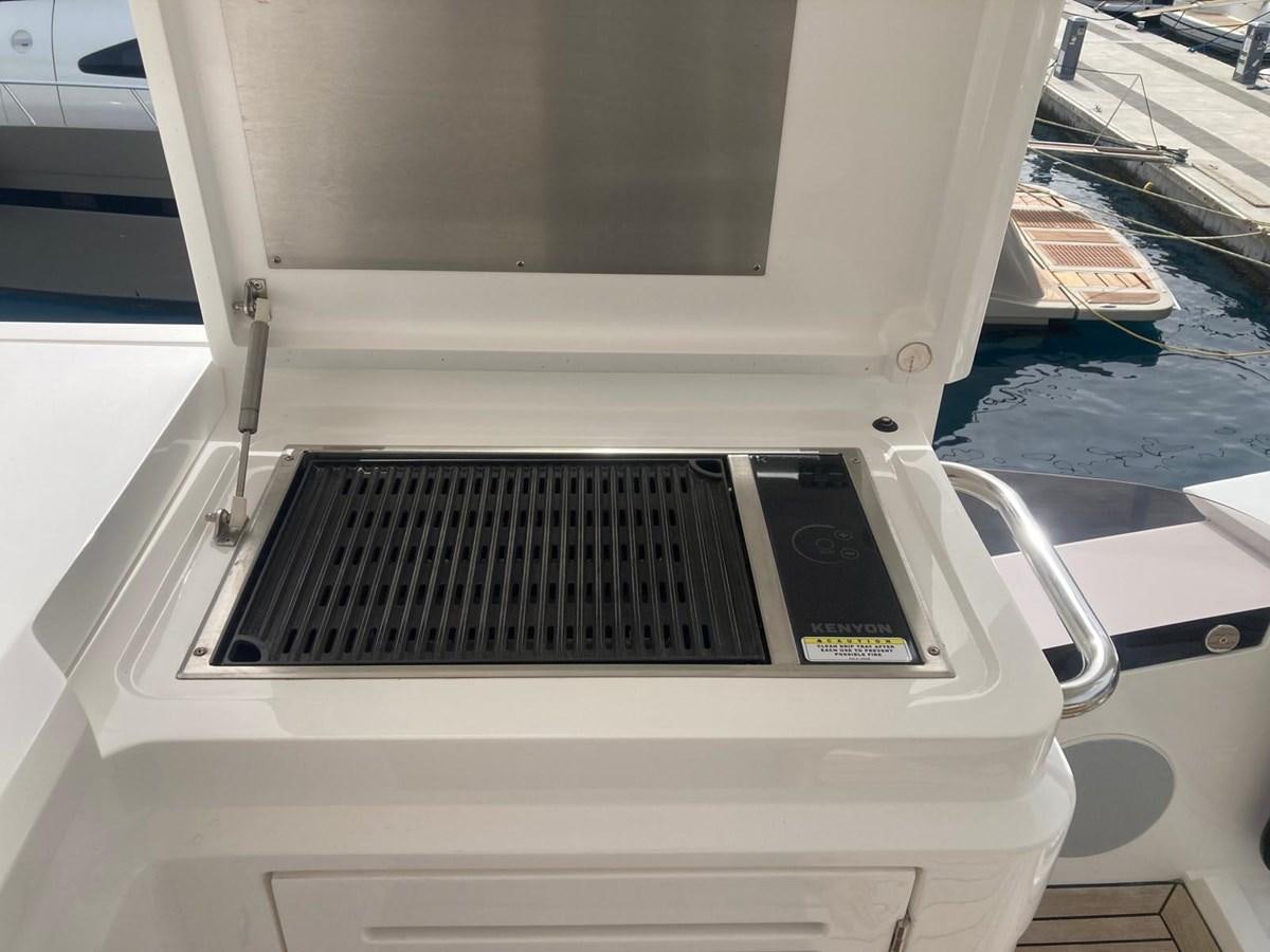 a white rectangular object with a black screen and a black object on it aboard CENGIZ Yacht for Sale