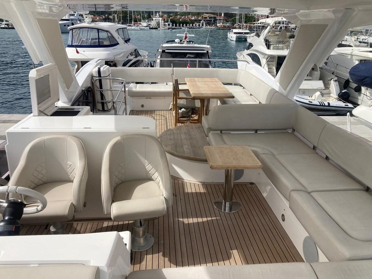 a boat dock with a bench and chairs on it aboard CENGIZ Yacht for Sale