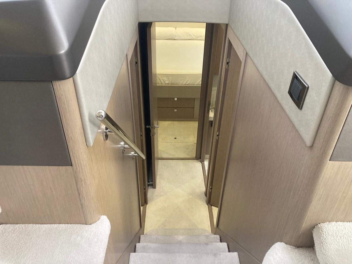a hallway with a door and a chair aboard CENGIZ Yacht for Sale