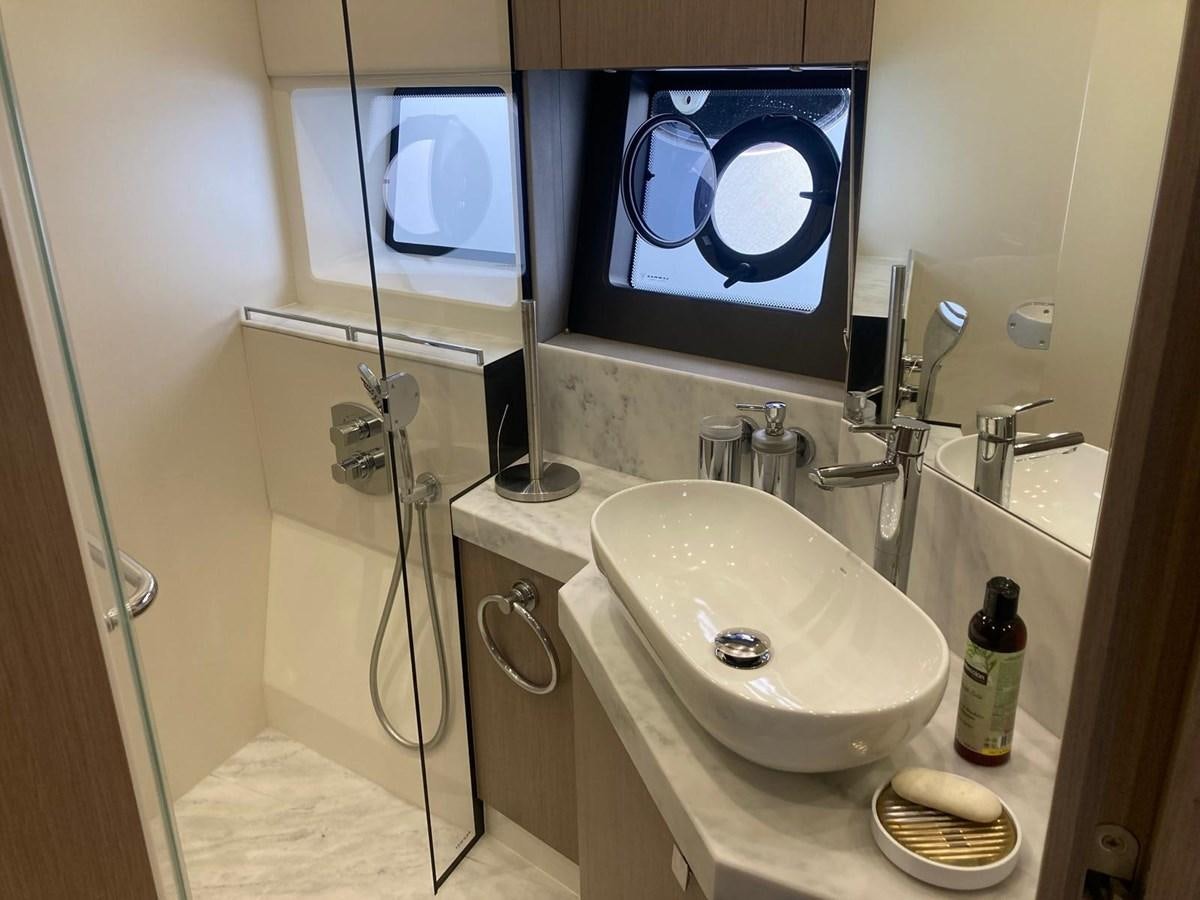 a bathroom with a sink and a mirror aboard CENGIZ Yacht for Sale