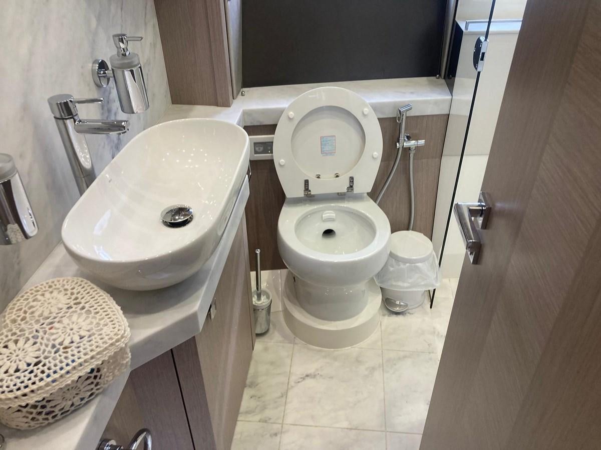 a bathroom with a toilet and sink aboard CENGIZ Yacht for Sale