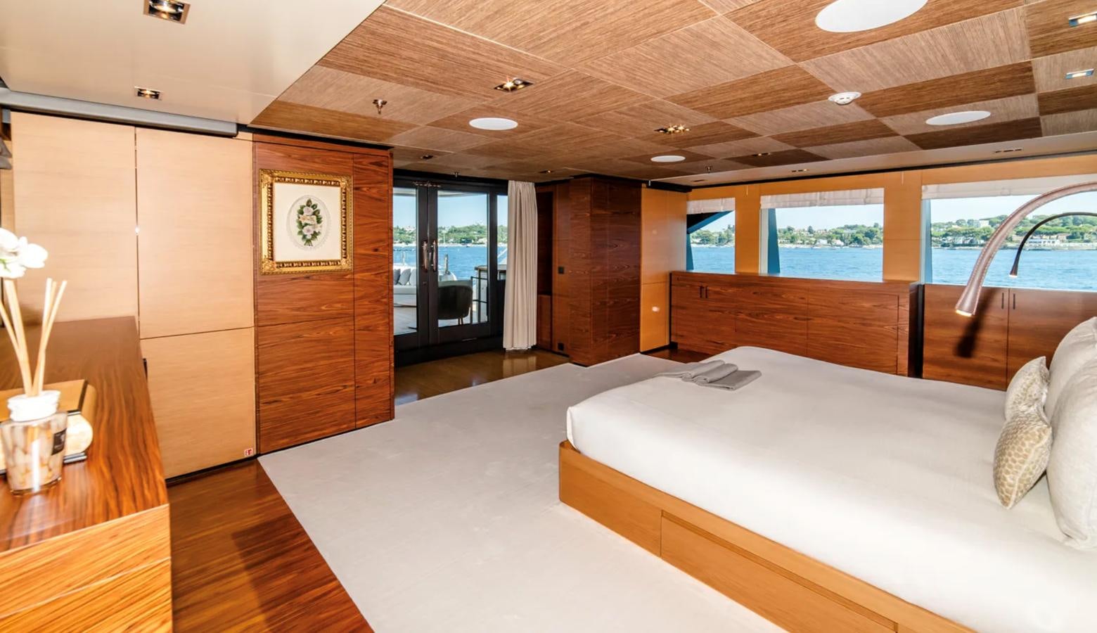 a room with a bed and a desk aboard ALI BABA Yacht for Sale