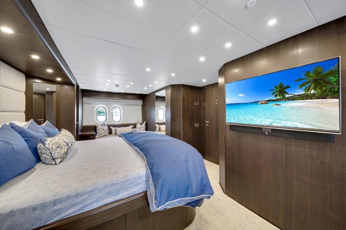 a room with a bed and a wood wall aboard MOONEN ROYAL DENSHIP 120 Yacht for Sale