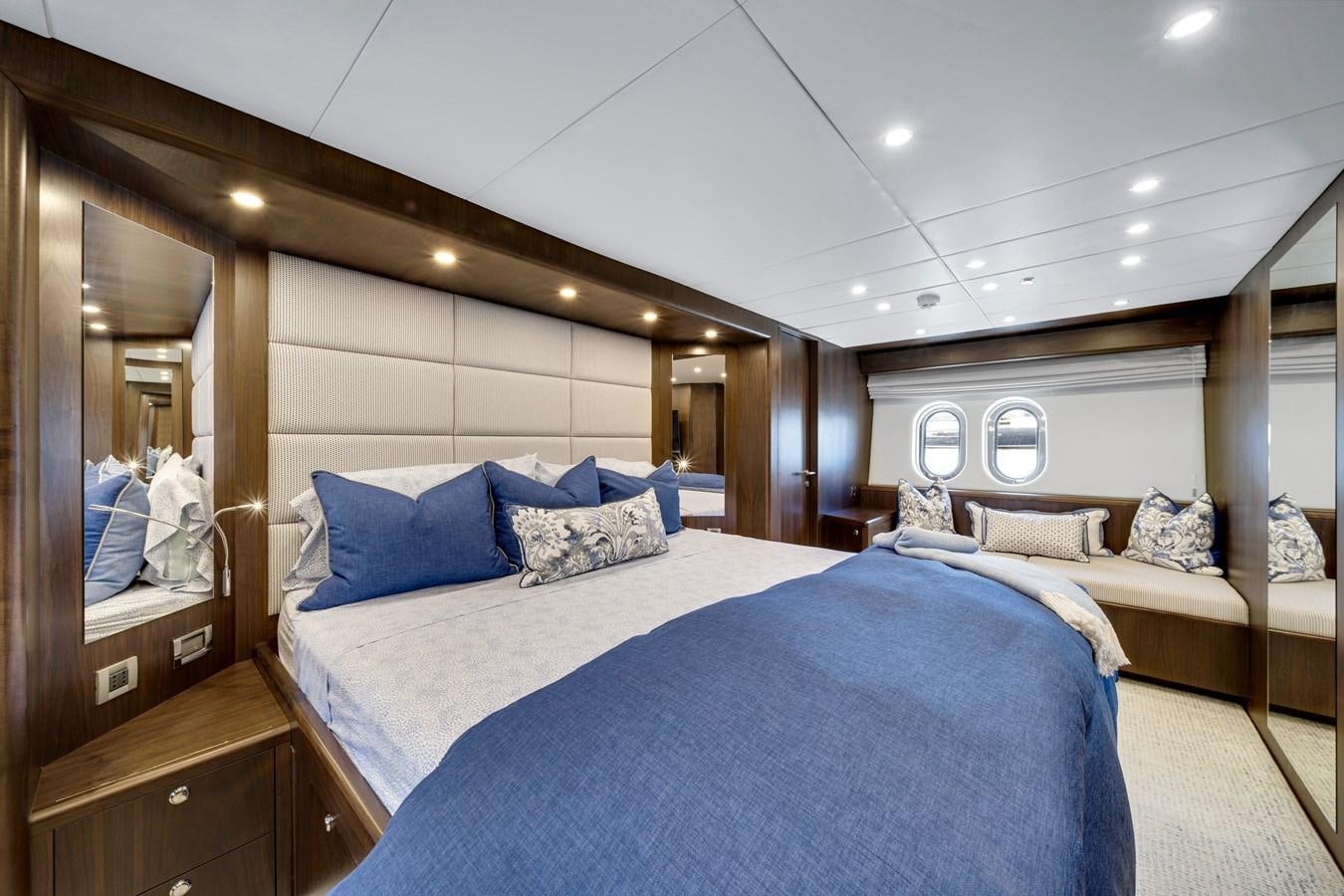 a room with a bed and a mirror aboard MOONEN ROYAL DENSHIP 120 Yacht for Sale