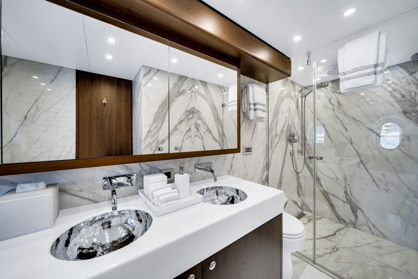 a bathroom with a large mirror aboard MOONEN ROYAL DENSHIP 120 Yacht for Sale