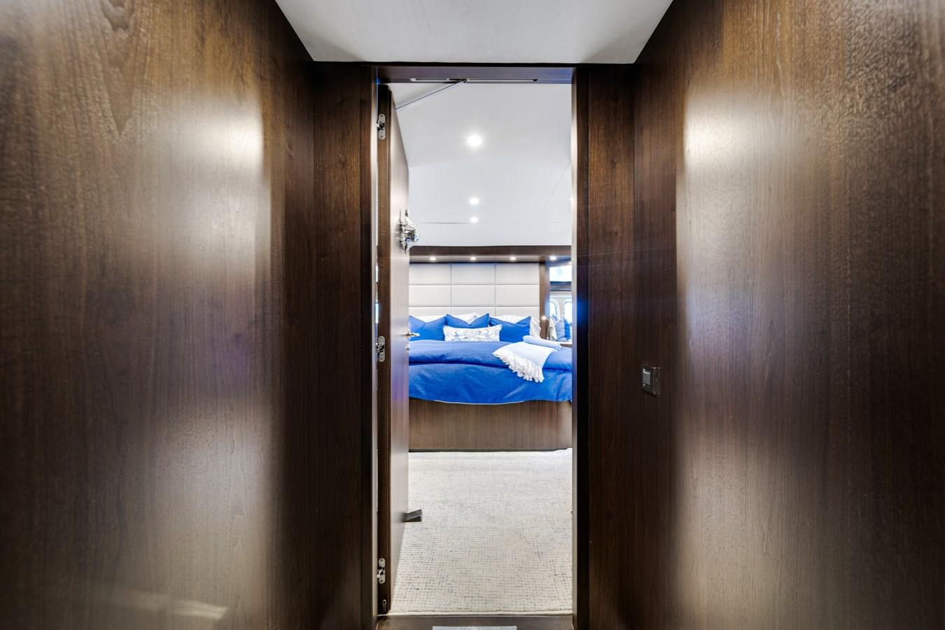 a room with a bed and a window aboard MOONEN ROYAL DENSHIP 120 Yacht for Sale