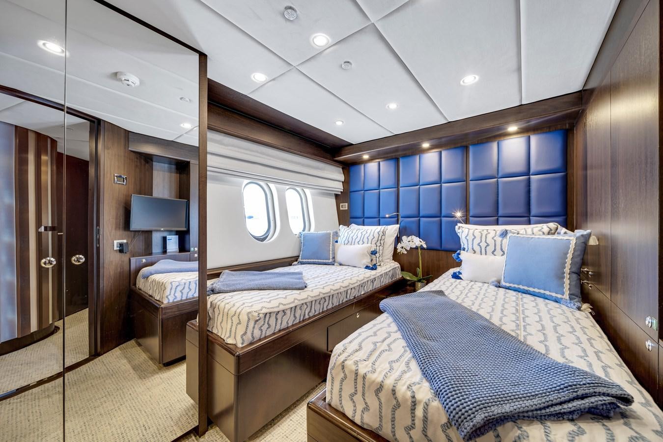 a room with two beds aboard MOONEN ROYAL DENSHIP 120 Yacht for Sale