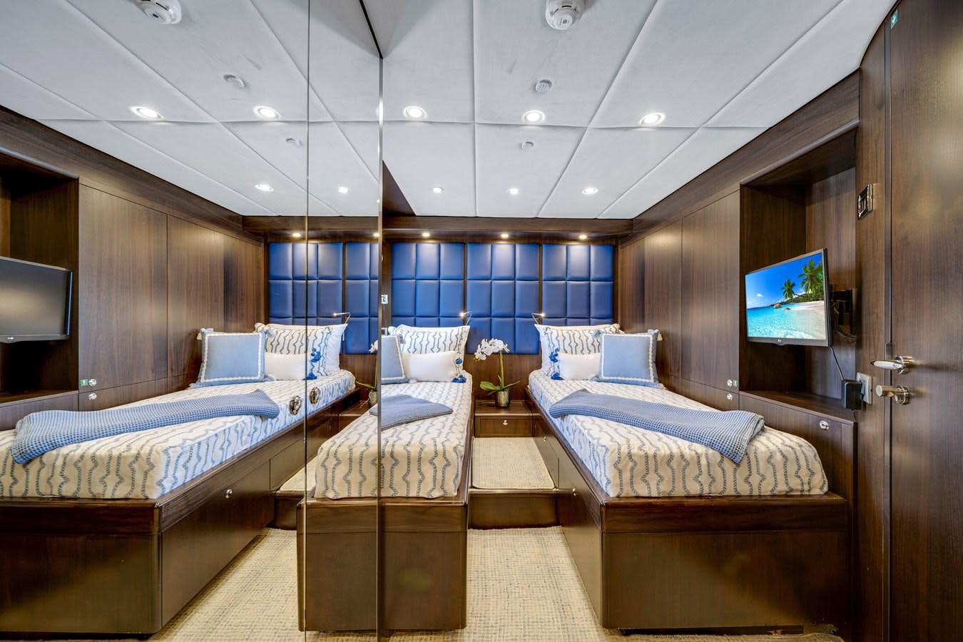 a room with a bed and a tv aboard MOONEN ROYAL DENSHIP 120 Yacht for Sale