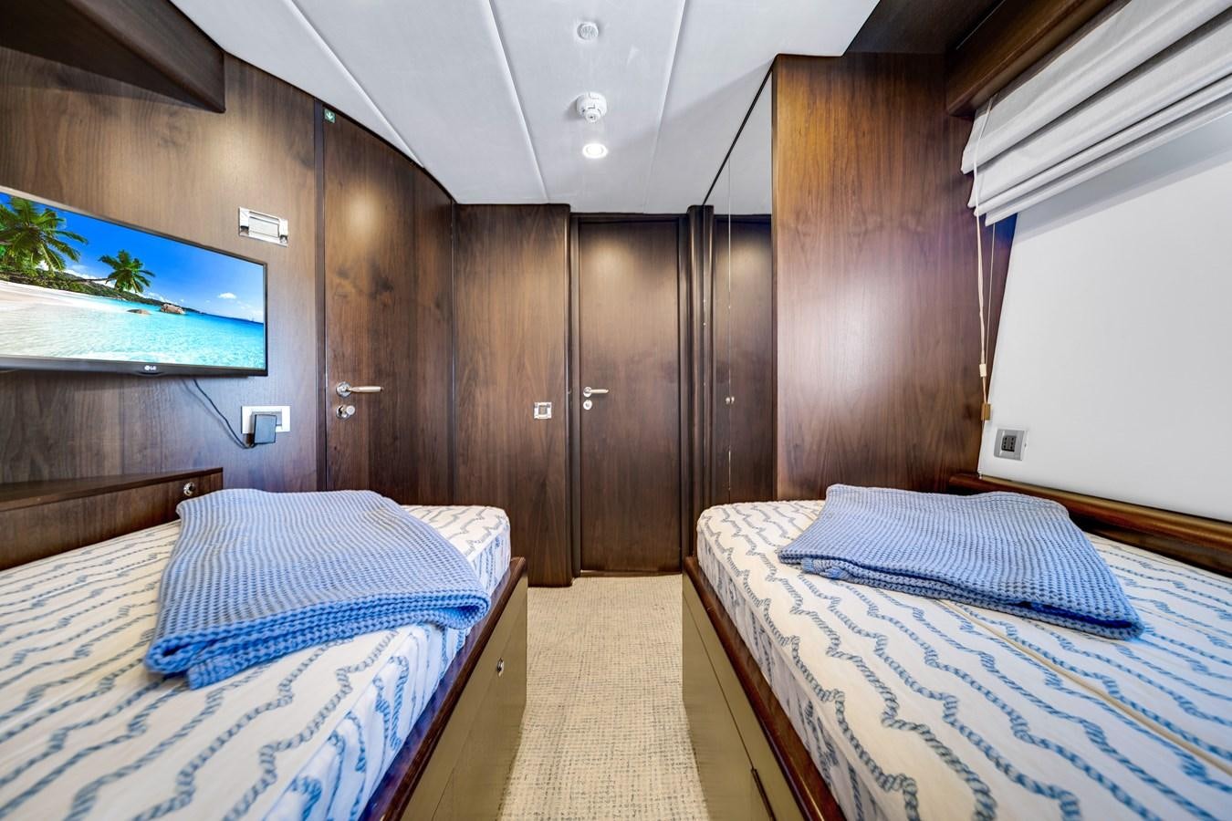a room with two beds aboard MOONEN ROYAL DENSHIP 120 Yacht for Sale