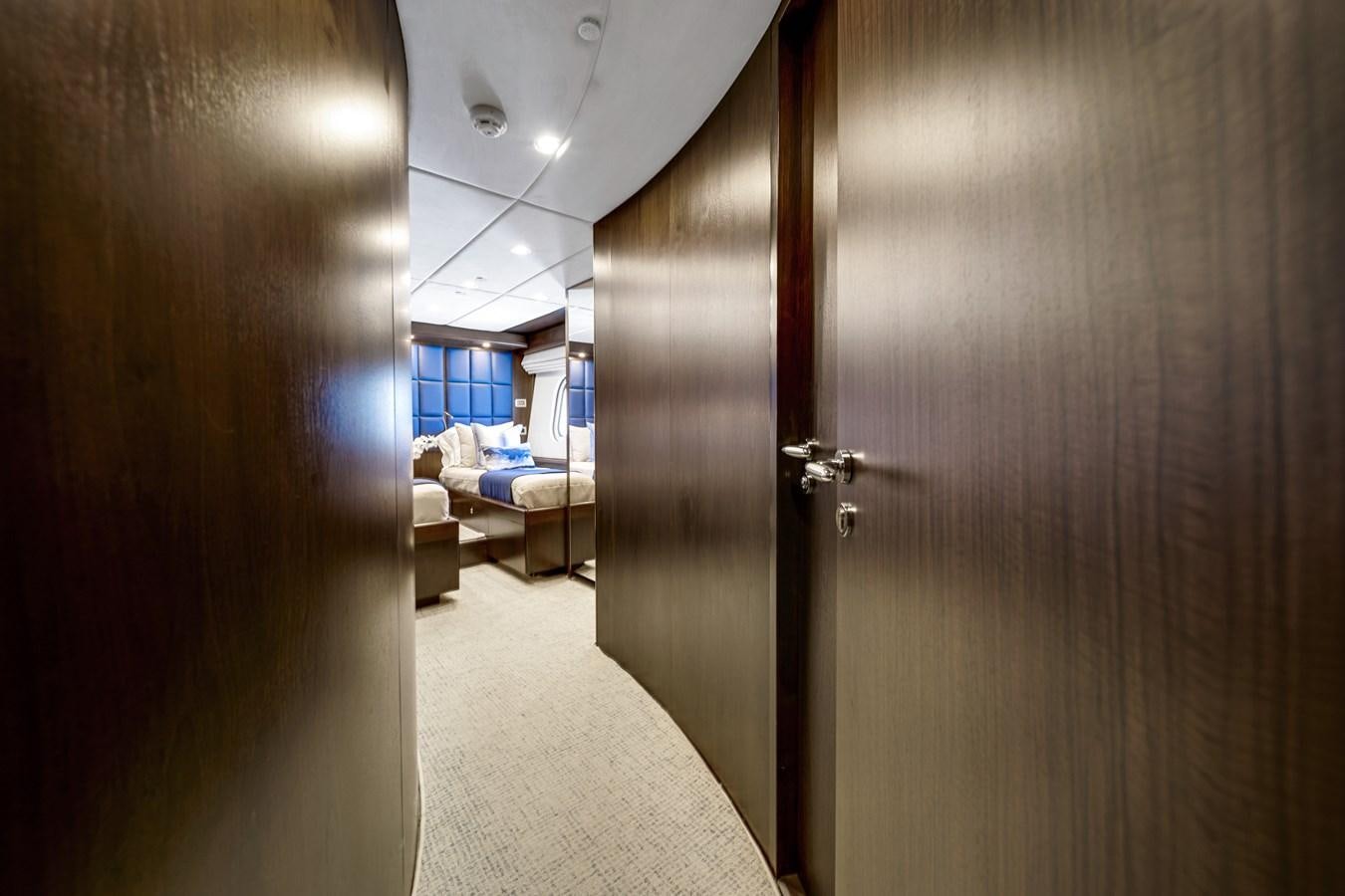 a hallway with a bed and a couch aboard MOONEN ROYAL DENSHIP 120 Yacht for Sale
