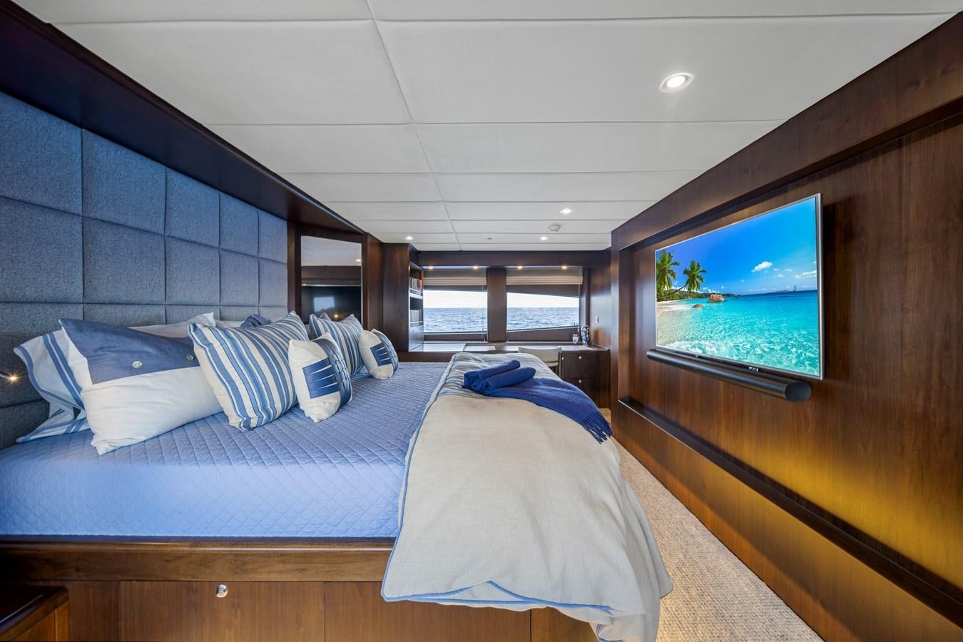 a room with a bed and a window aboard MOONEN ROYAL DENSHIP 120 Yacht for Sale